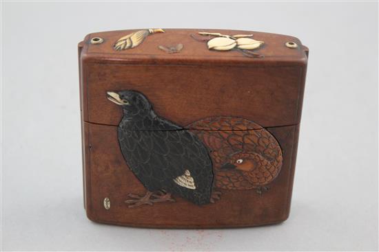 A Japanese cherrywood, ivory, horn, mother of pearl and wood inlaid single case inro, 19th century, 9cm.